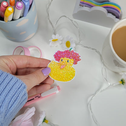 cute holographic sticker of a duck with a flower on it's head