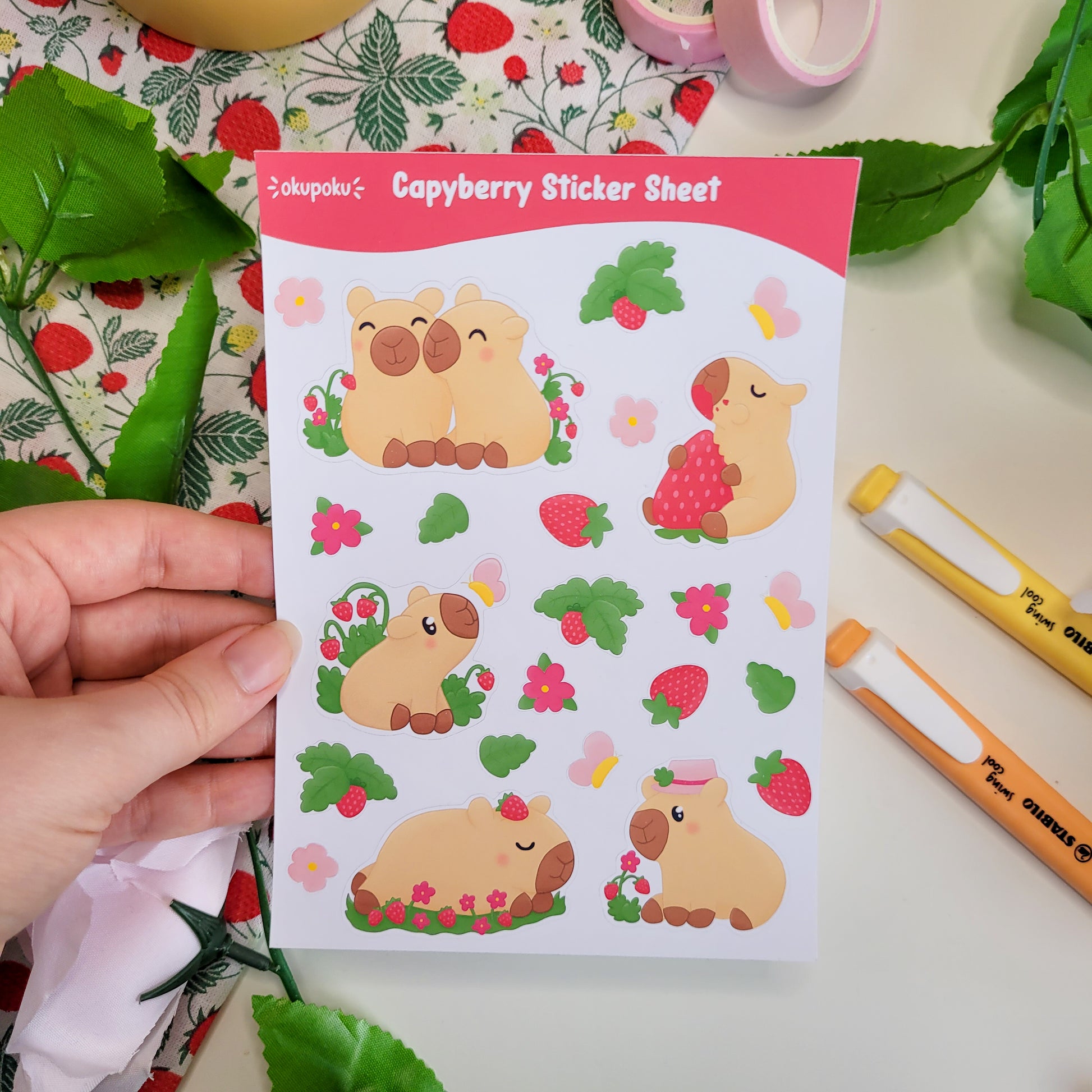 a stickersheet featuring cute capybaras, strawberries, flowers and butterflies