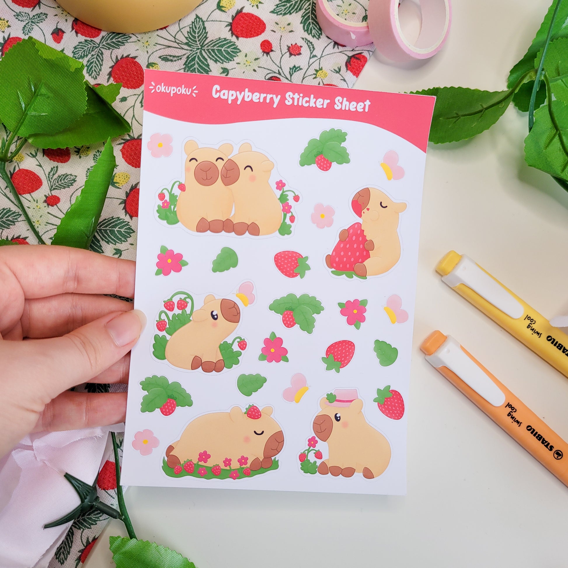 a stickersheet featuring cute capybaras, strawberries, flowers and butterflies