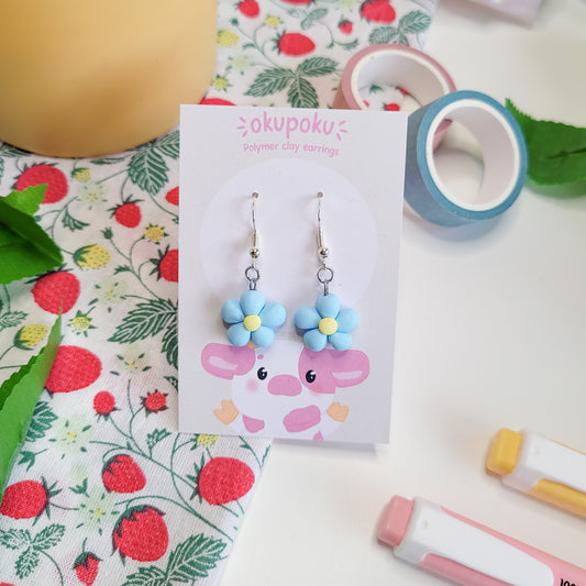 cute handmade blue daisy earrings made out of polymer clay