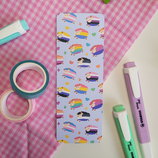 Colourful bookmark featuring a design of sheep with different pride flags on them