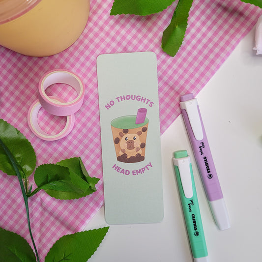 Cute green bookmark featuring a capybara in a bubble tea with the text "No thoughts head empty"