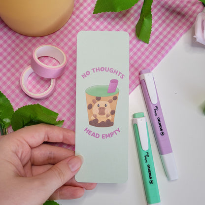 Cute green bookmark featuring a capybara in a bubble tea with the text "No thoughts head empty"