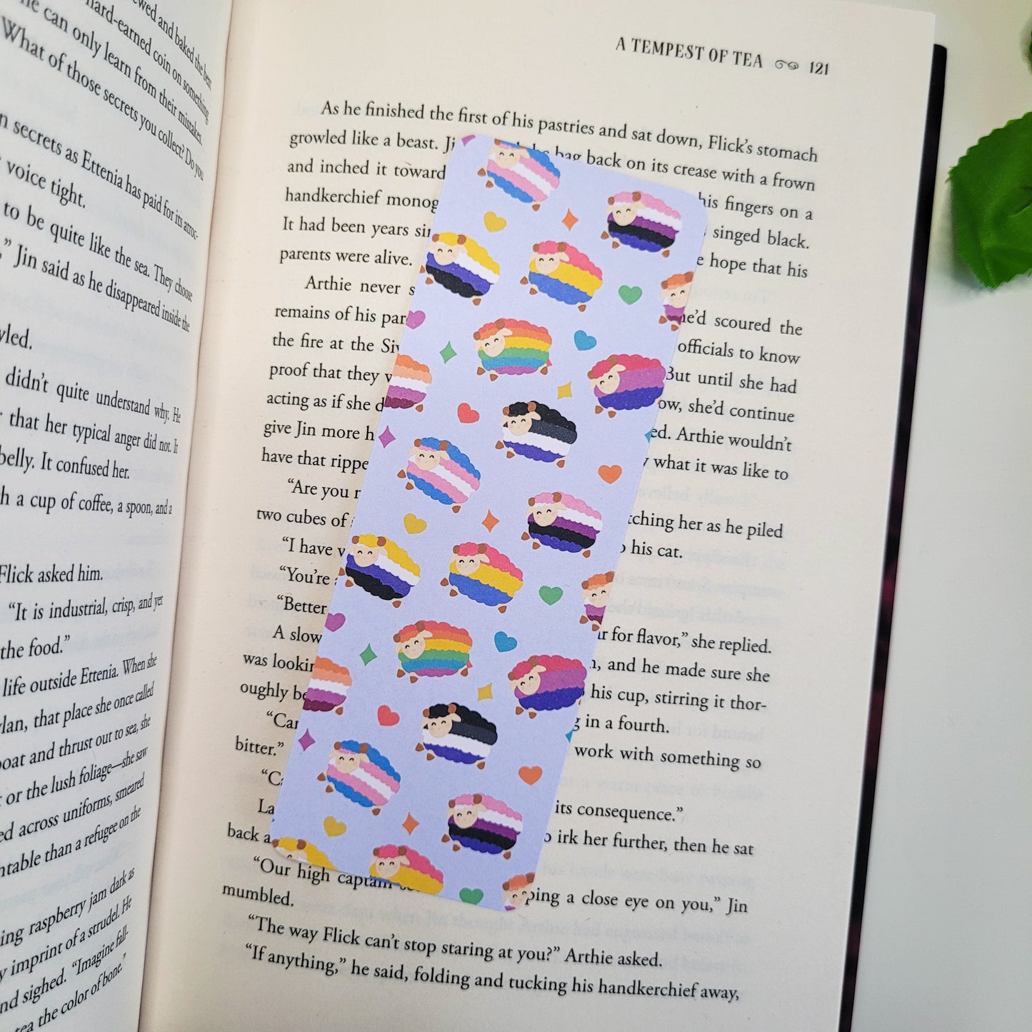 Colourful bookmark featuring a design of sheep with different pride flags on them