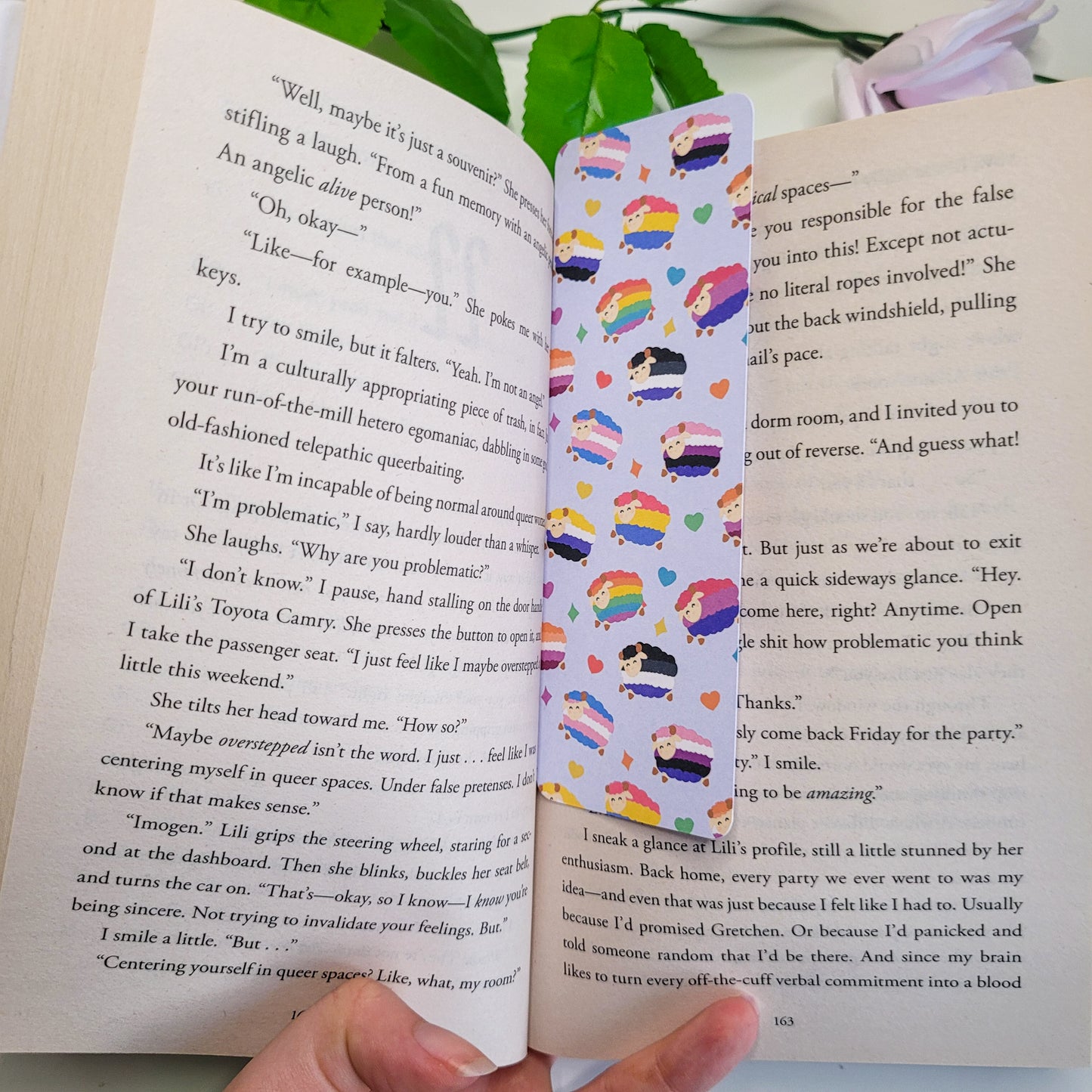 Colourful bookmark featuring a design of sheep with different pride flags on them