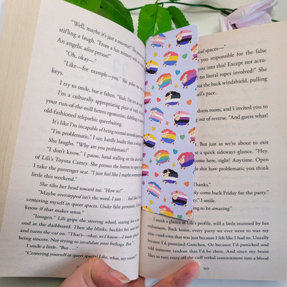 Colourful bookmark featuring a design of sheep with different pride flags on them