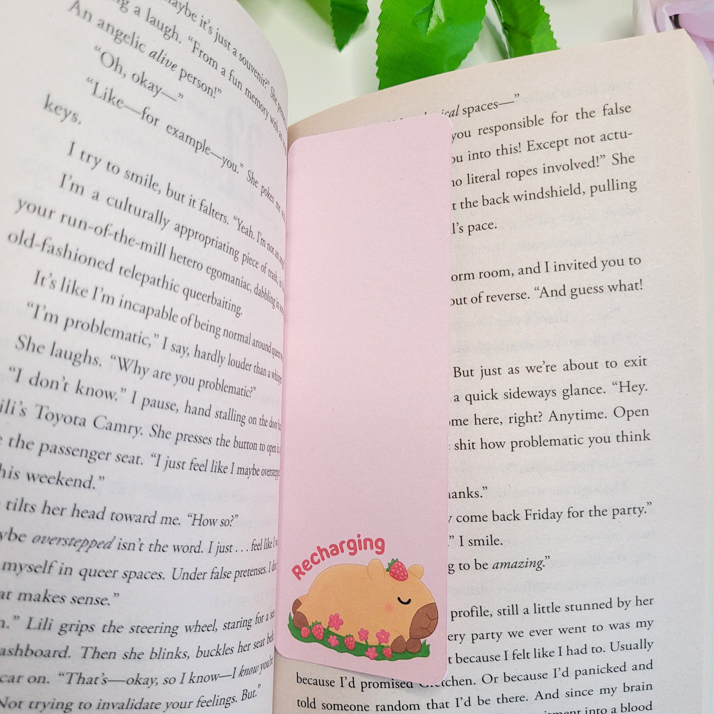 Cute sleeping capybara bookmark featuring the text "Recharging"