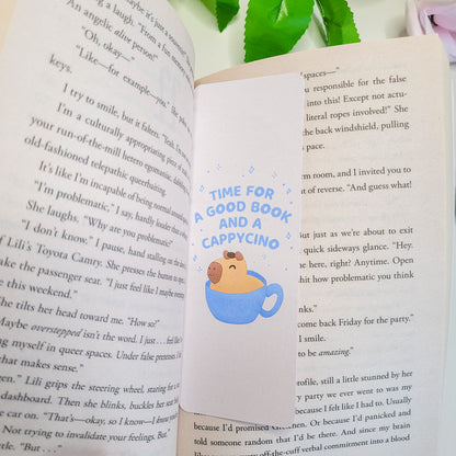 cute bookmark featuring a capybara in a capycino mug and the text: "time for a good book and a capycino"