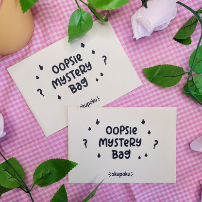 A pack of oopsie mystery stickers and a bookmark