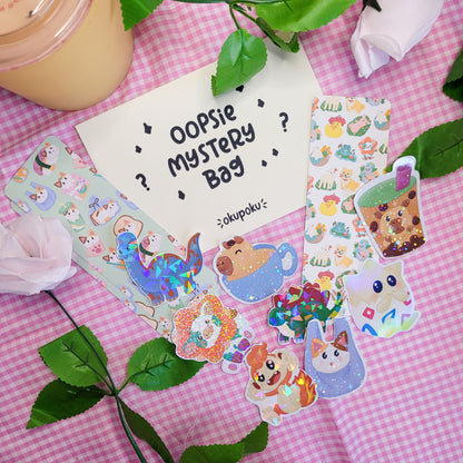 A pack of oopsie mystery stickers and a bookmark