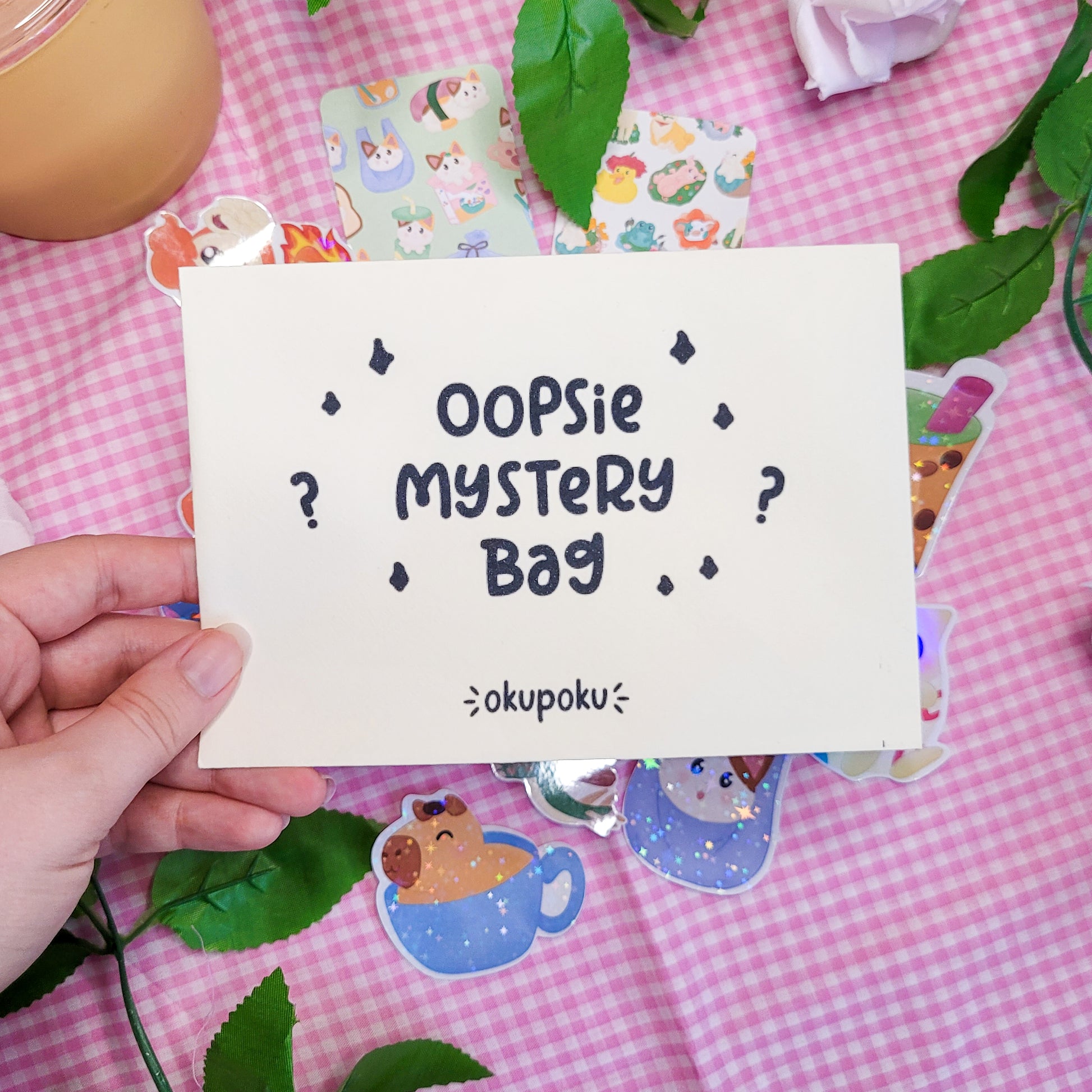 A pack of oopsie mystery stickers and a bookmark