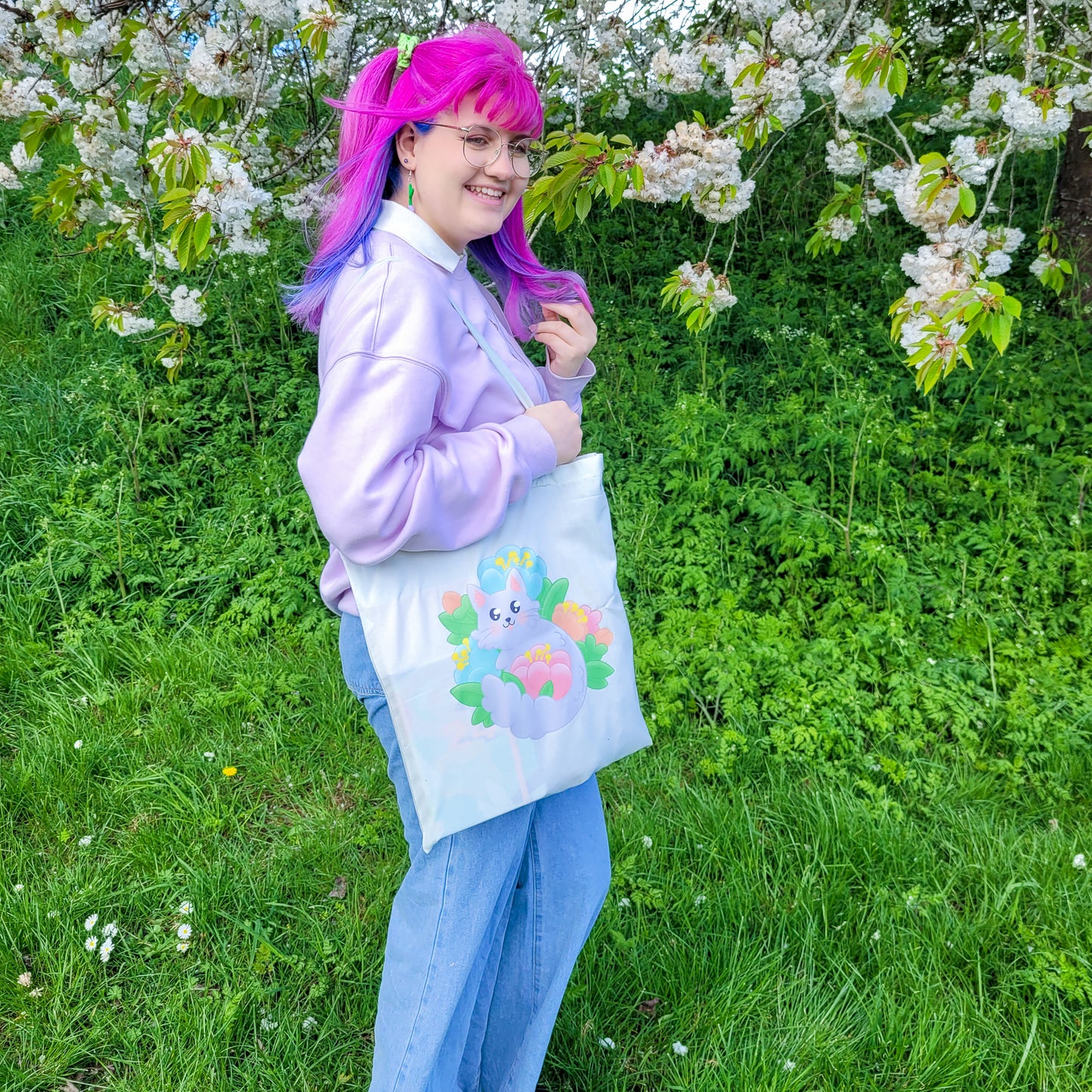 Light mint tote bag featuring a grey cat surrounded by colourful flowers