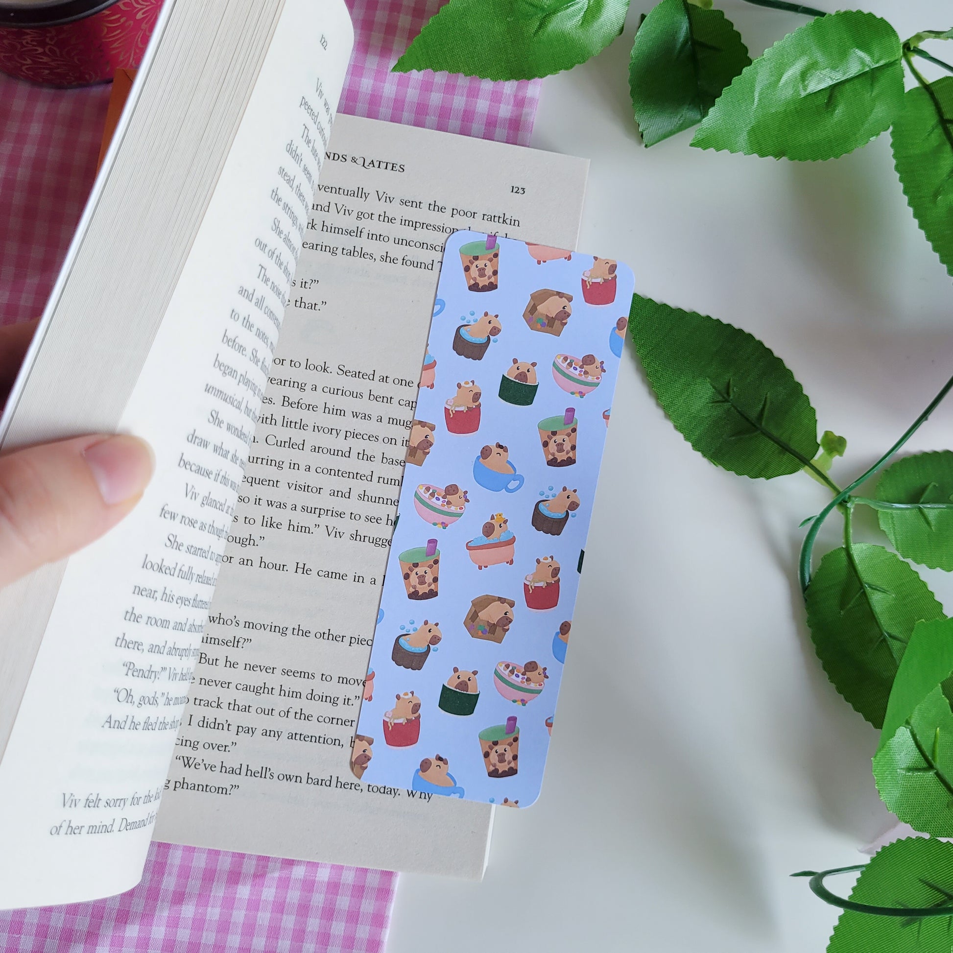 Cute bookmark featuring a design of silly capybaras in things