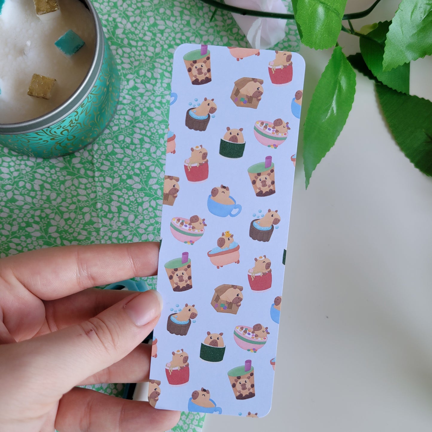 Cute bookmark featuring a design of silly capybaras in things