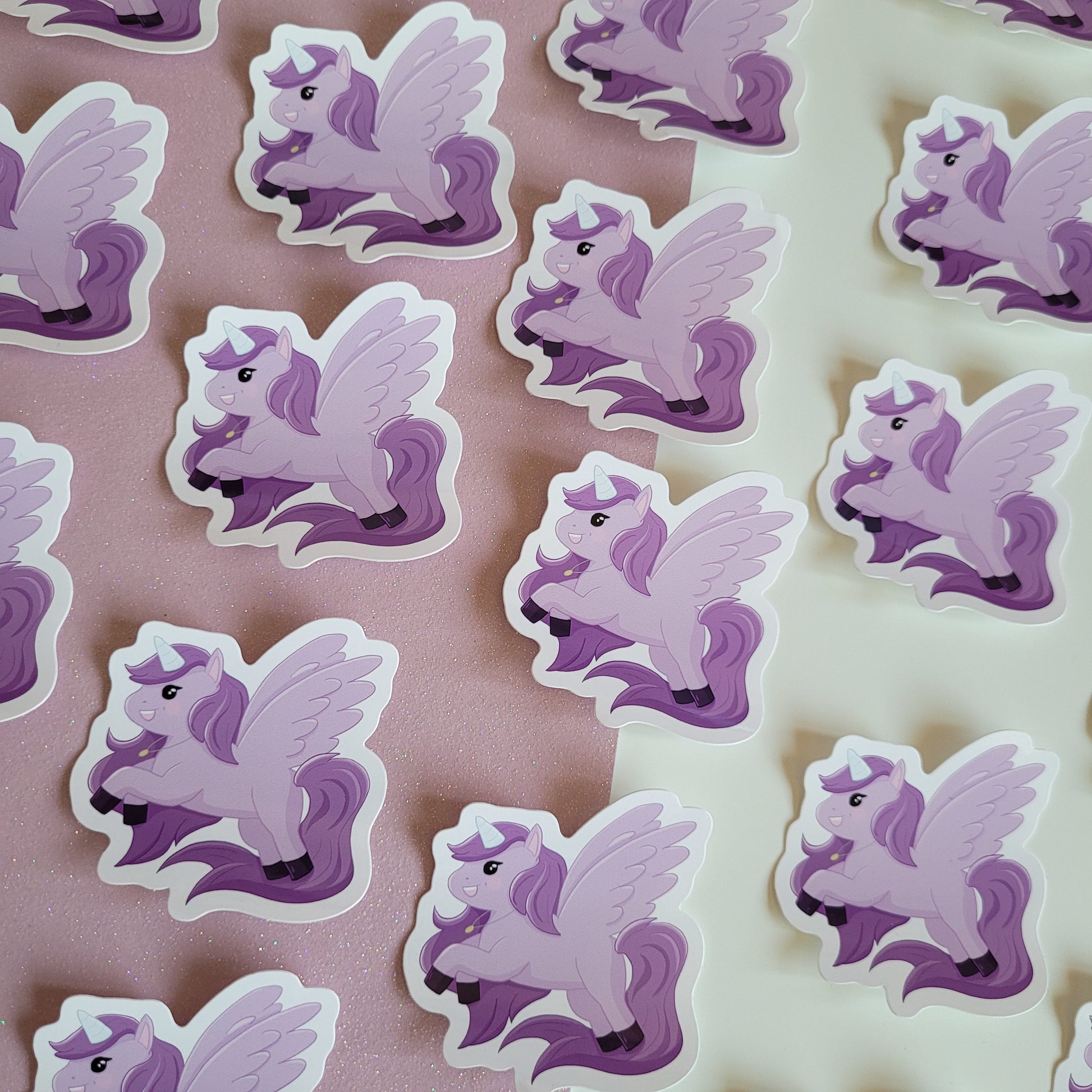 Cute sticker featuring a purple unicorn design