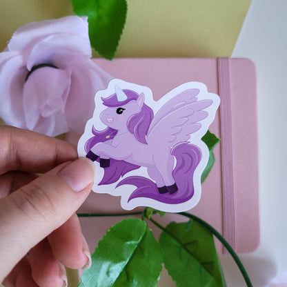 Cute sticker featuring a purple unicorn design