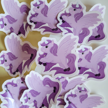 Cute sticker featuring a purple unicorn design