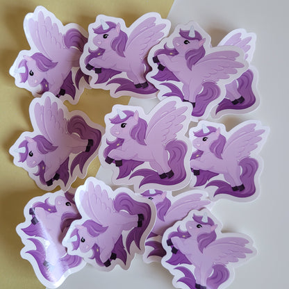 Cute sticker featuring a purple unicorn design