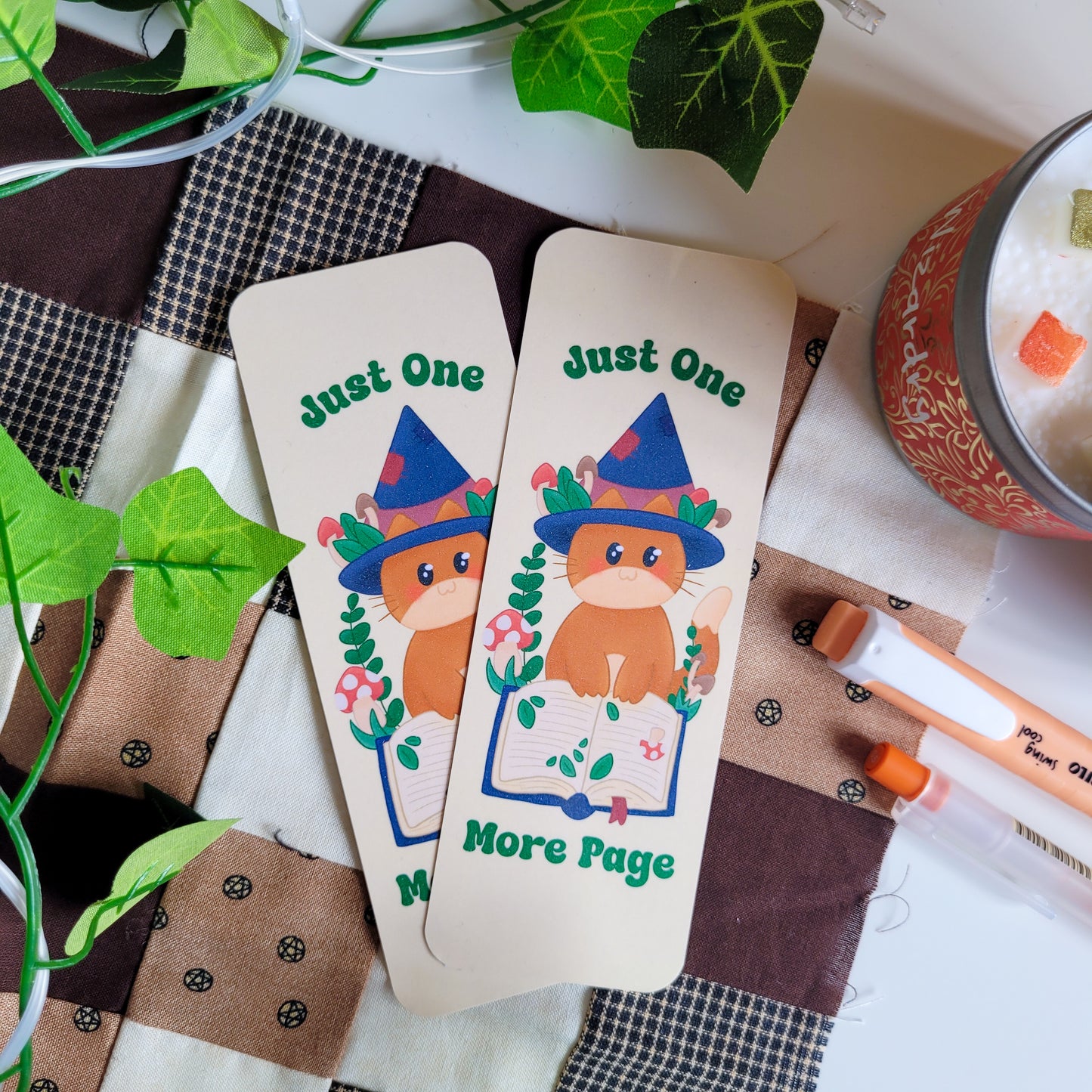 Cute cat witch bookmark featuring the text &quot;Just one more page&quot;