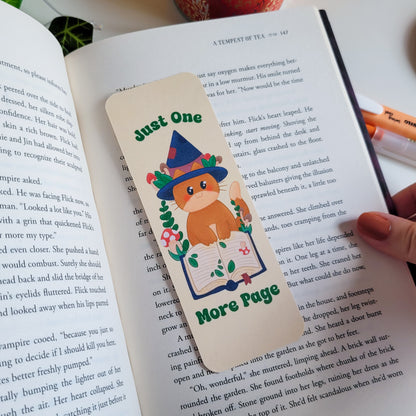 Cute cat witch bookmark featuring the text &quot;Just one more page&quot;