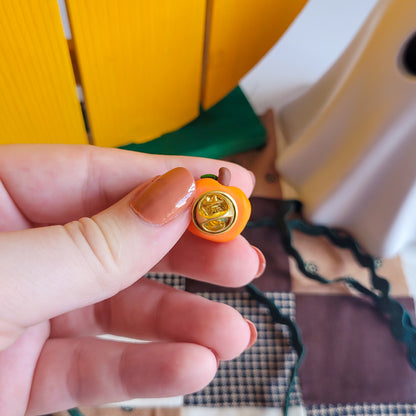 Pumpkin pin badge made out of polymer clay