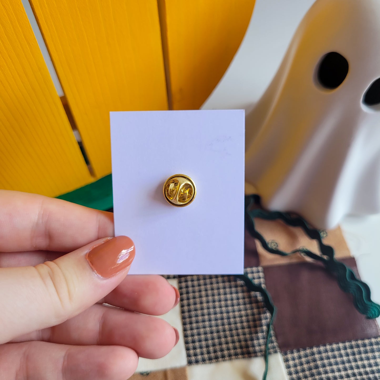 Pumpkin pin badge made out of polymer clay