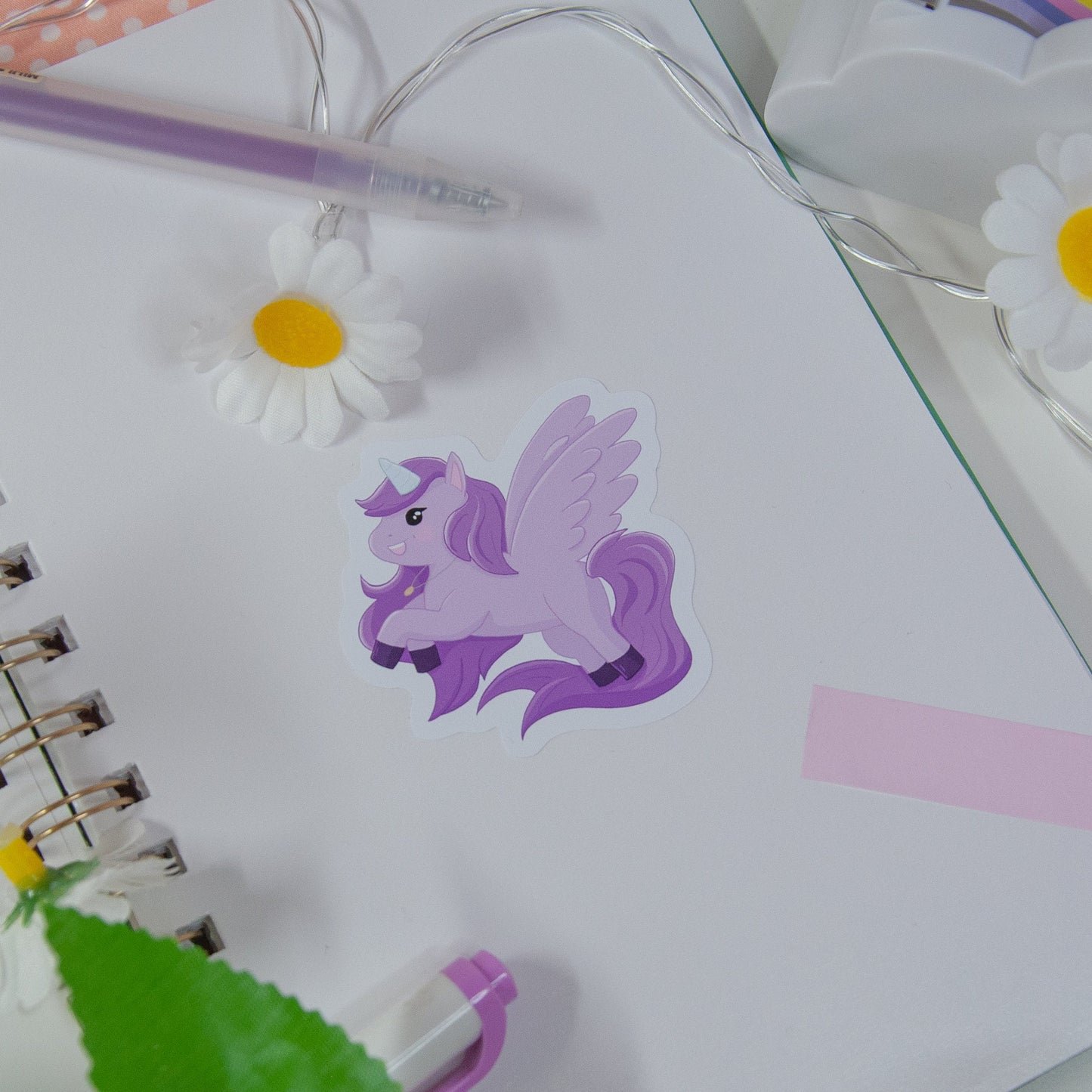 Cute sticker featuring a purple unicorn design