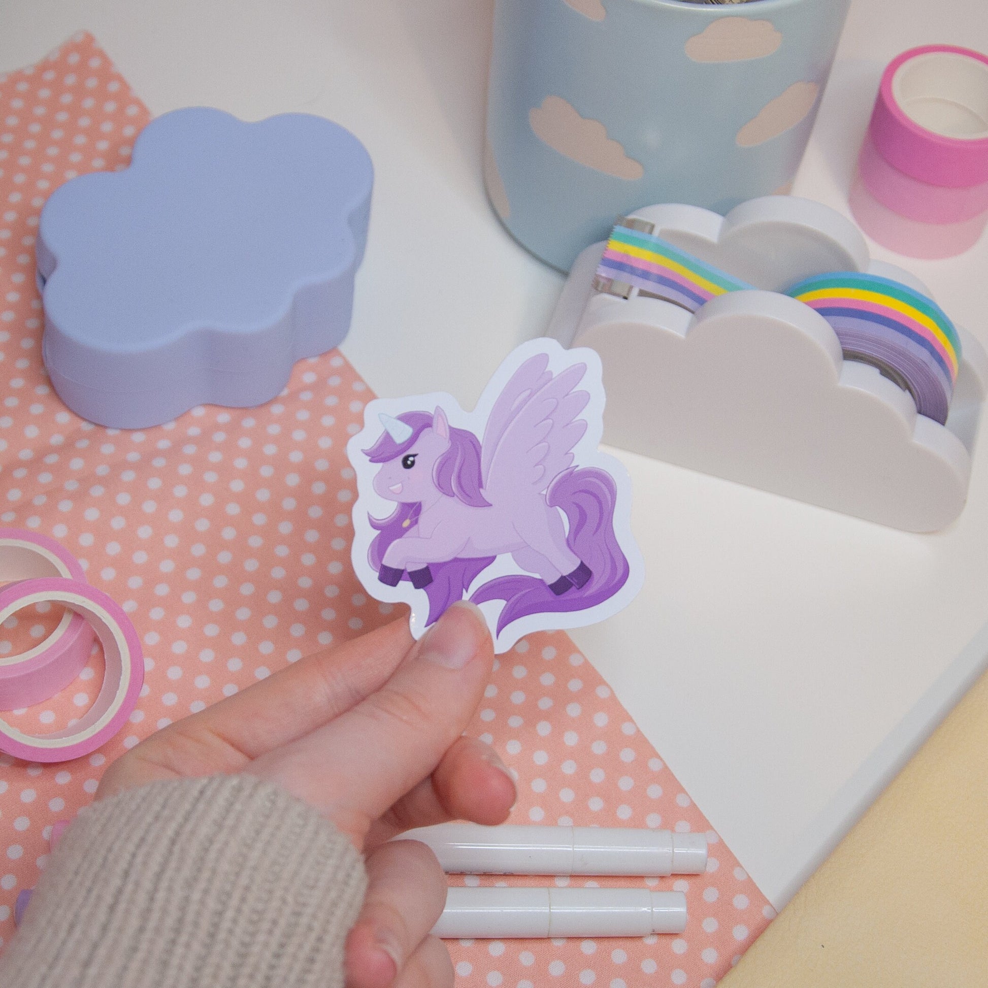 Cute sticker featuring a purple unicorn design