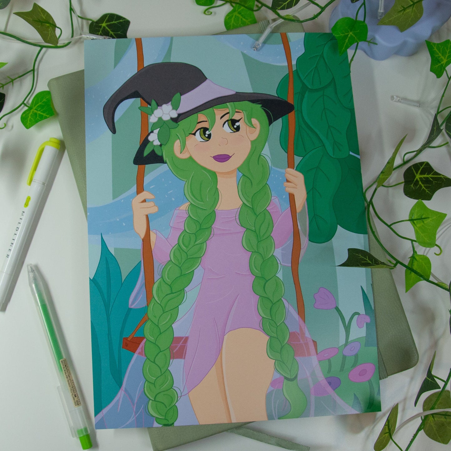 Art print of a witch character sat on a swing in a magical garden