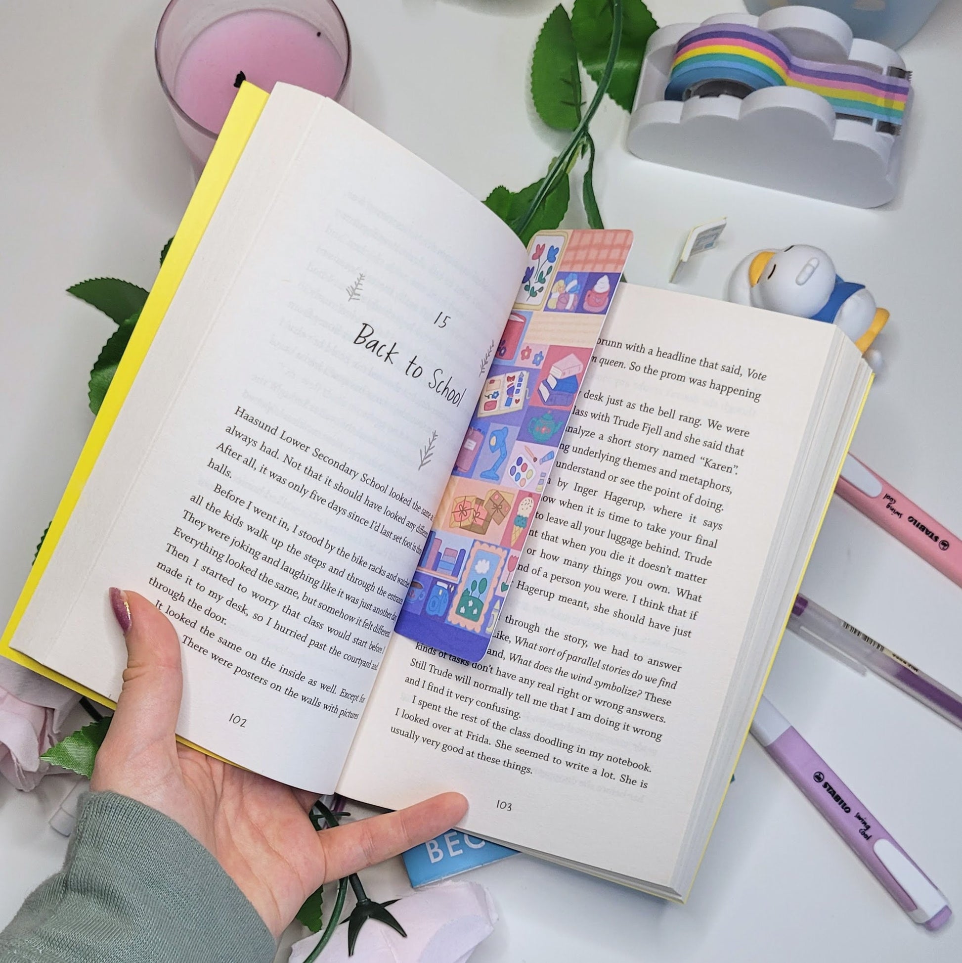 cute bookmark with a patchwork pattern of comfy themed illustrations such as a book, hot chocolate, flowers and more