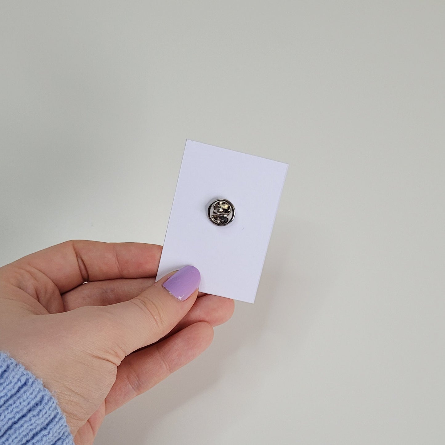 cute handmade blue daisy pin badge made out of polymer clay