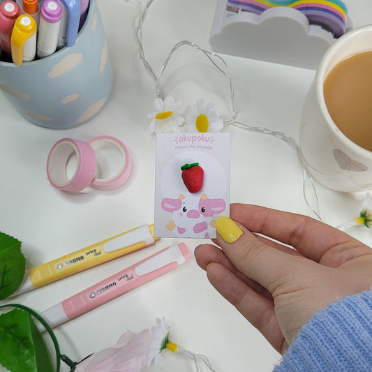 Cute strawberry pin badge made out of polymer clay